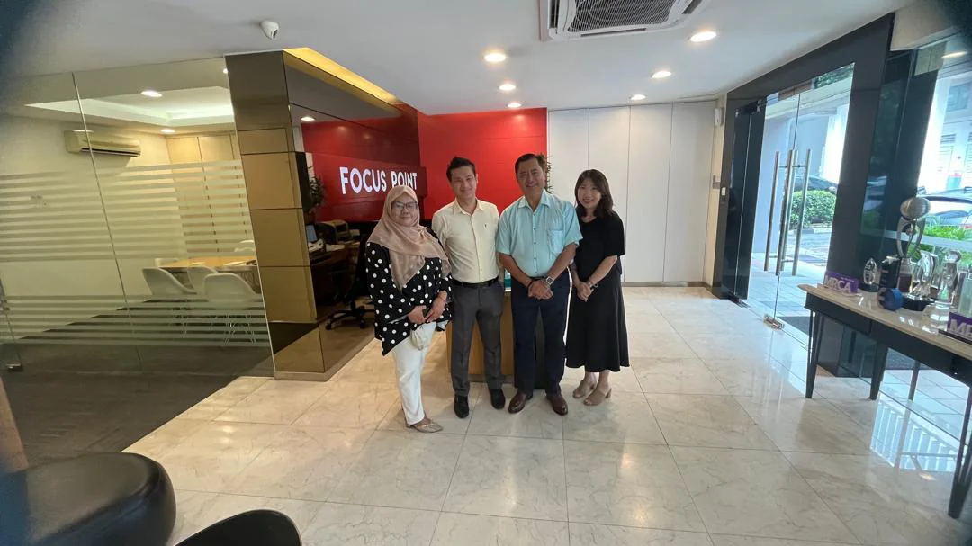 Mr Austin, the Focus Point team, and the OneWorks Assistance Management Team during their visit