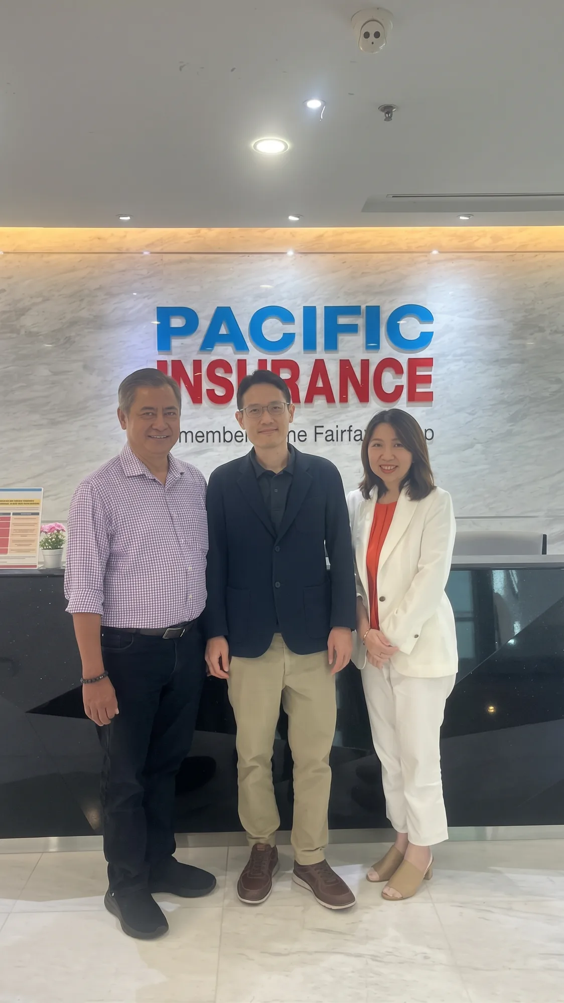 OneWorks Assistance and Pacific Insurance representatives at the Pacific Insurance office